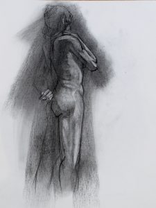A charcoal drawing of a nude man standing from behind.